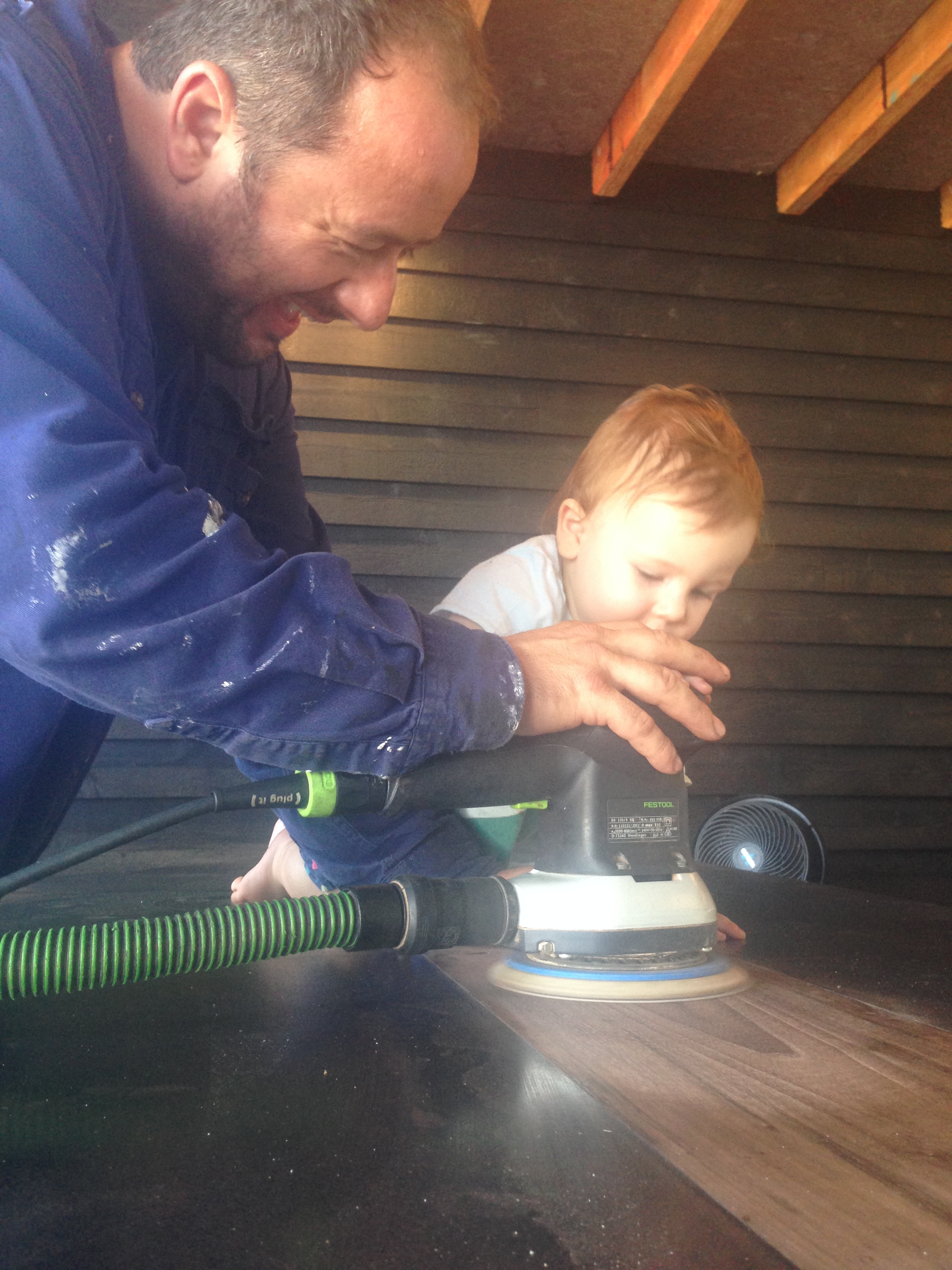 Artie helps his dad build the table.