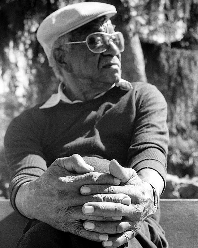 This gentleman here, Mr. Carrol Chornton, was sitting on a bench watching commuters pour out of the NL bus, then walk bike or scooter down grand &amp; because I&rsquo;m always drawn to people who aren&rsquo;t in a rush I had to ask him what his story