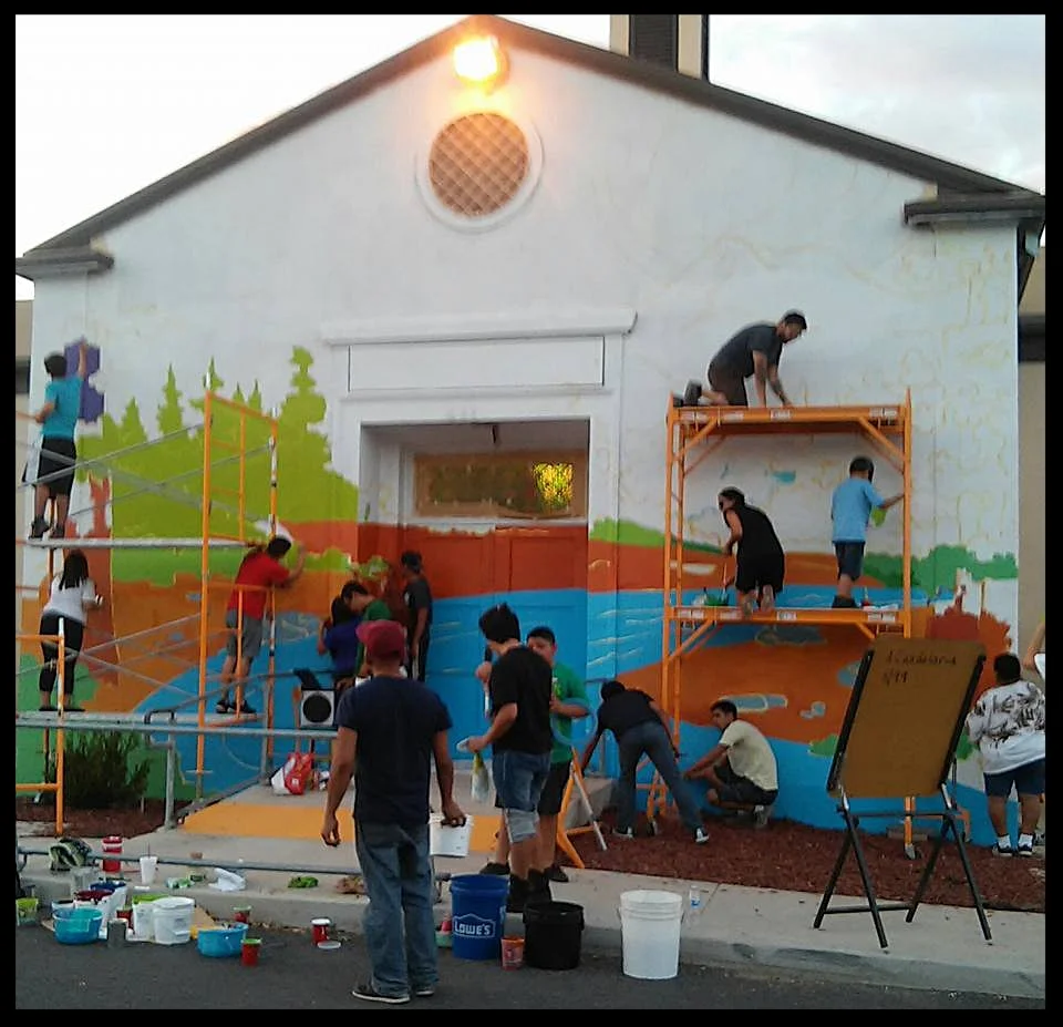 Victor Cervantes facilitates a mural project on the local community center in Porterville, CA: Comisión Honorífica Mexicana Americana (CHMA)
