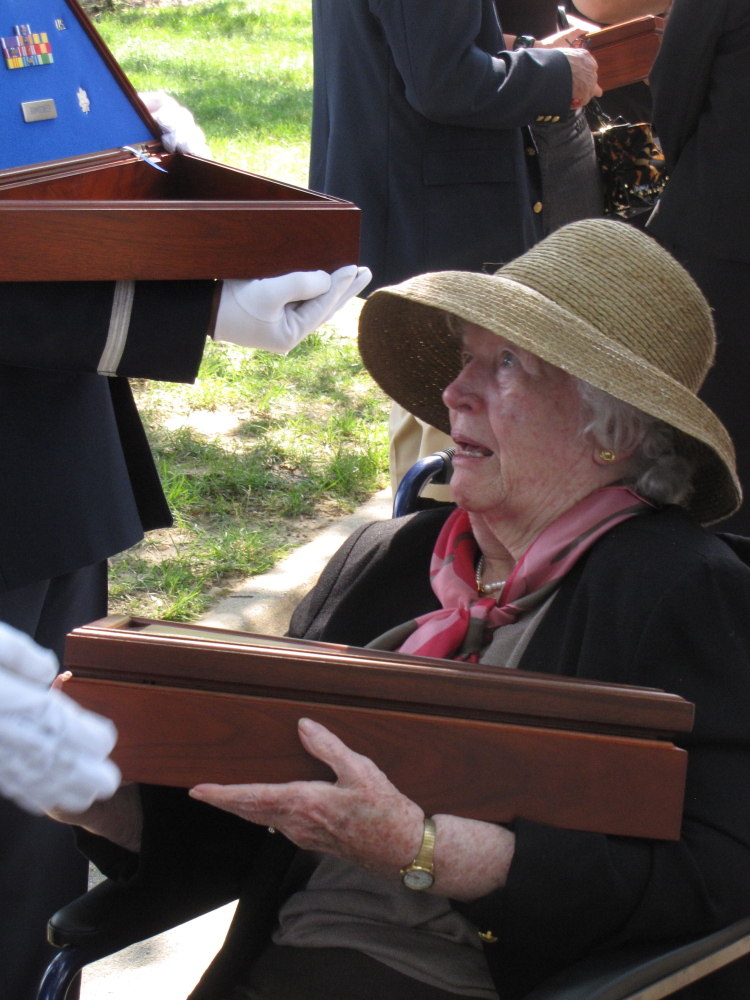 Rosemary Pearce receiving the flag from her son's coffin. Photo courtesy of Pearce family.