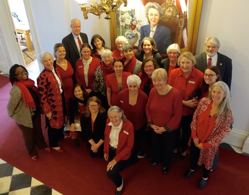 MOLLIE (KNEELING, FOURTH FROM LEFT) WITH LEGISLATIVE COLLEAGUES CELEBRATING THE EQUAL PAY DAY RESOLUTION IN APRIL 2016 PHOTO COURTESY OF MOLLIE BURKE
