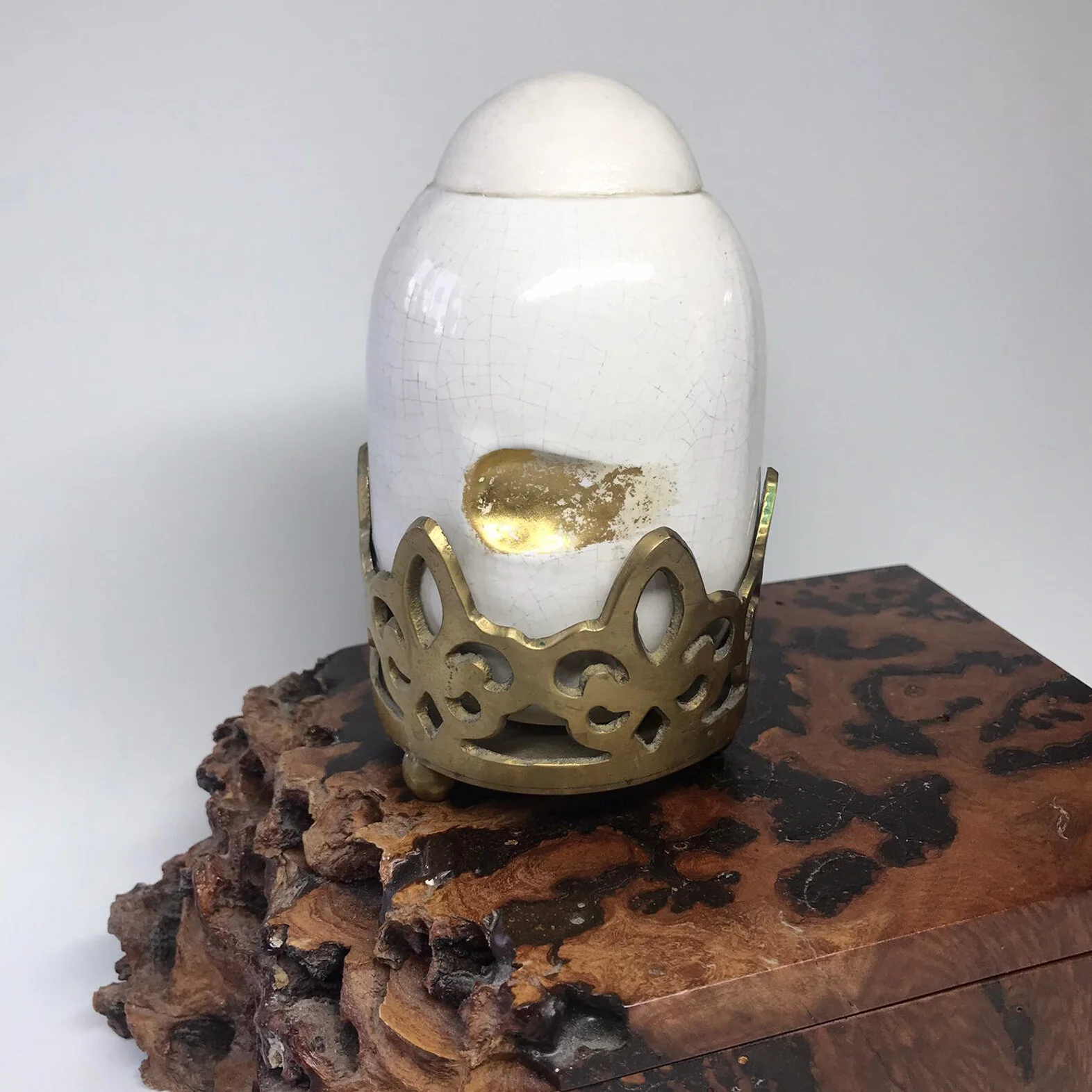 white pot on gold stand and wood box.jpg