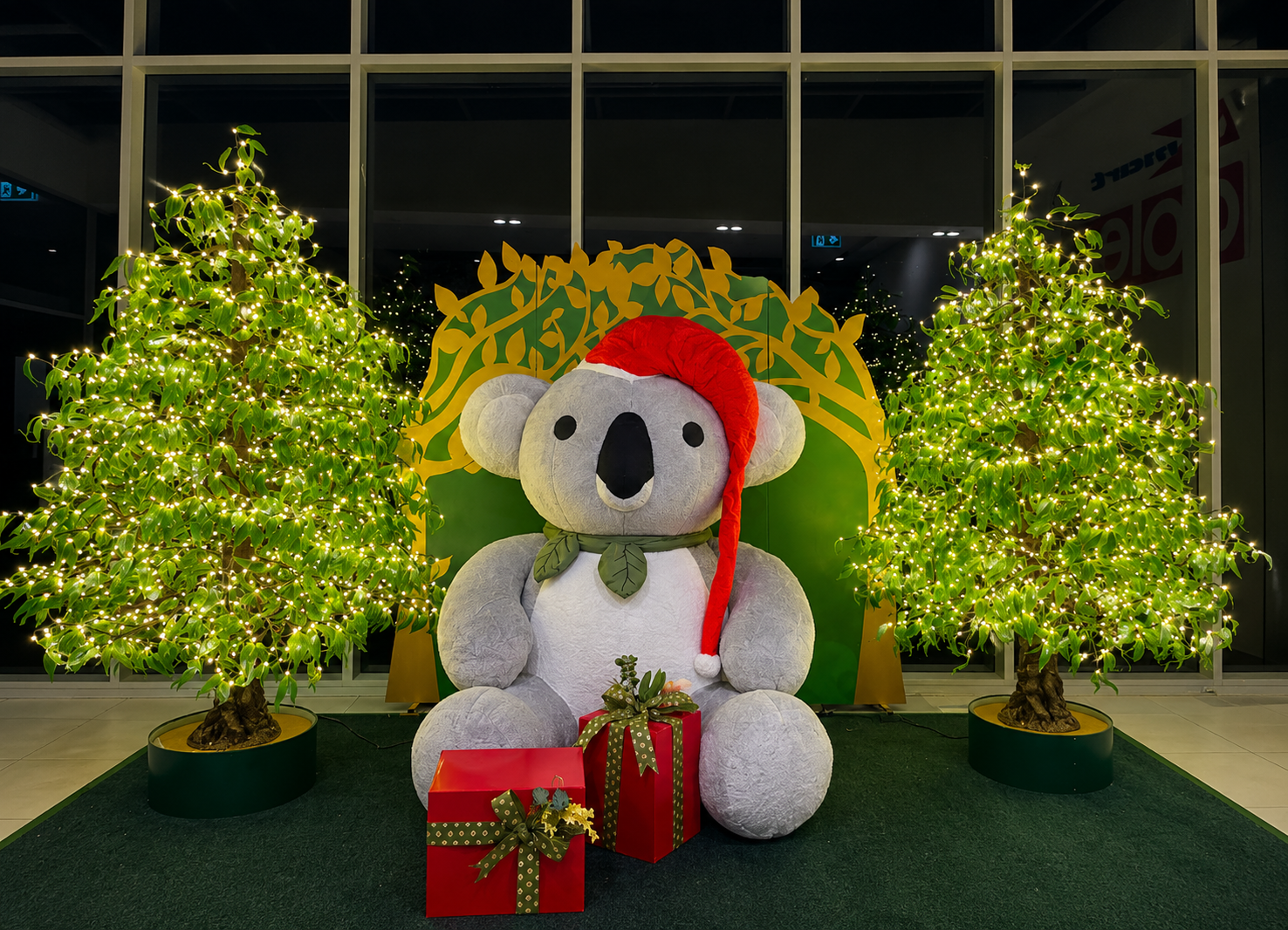Holiday koala with festive decor.png