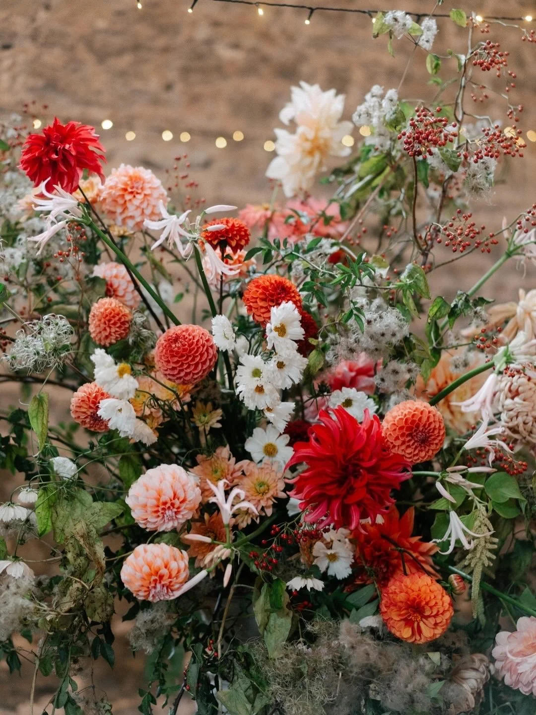 Embracing the magic of autumn for R&amp;G&rsquo;s delightful wedding @pristonmill . Golden sunlight and flickering candlelight drenched the occasion, letting the warm tones of the flowers sing. We layered British chrysanthemums, coreopsis and the las