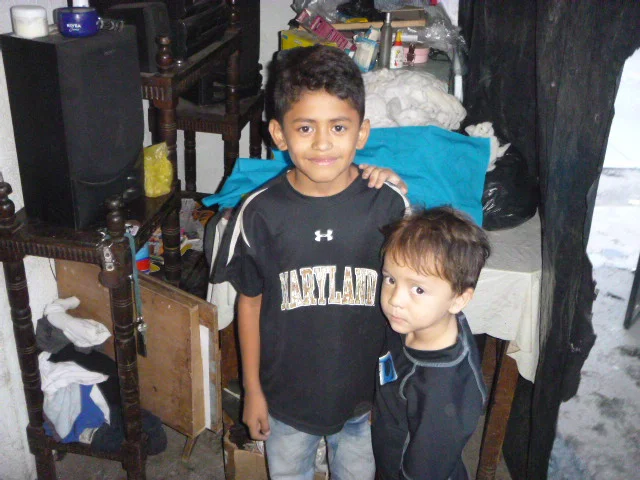 Jeferson and his brother at home