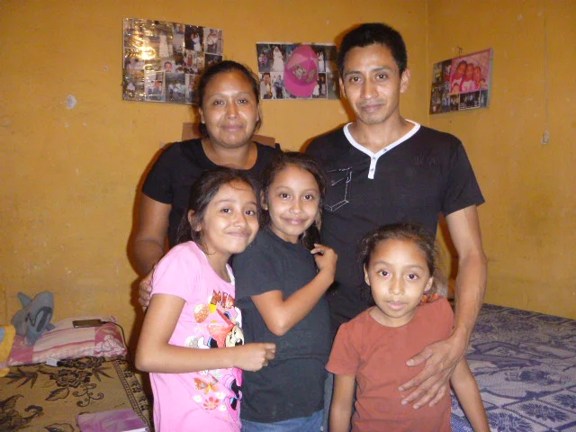 Fernanda with her family at home