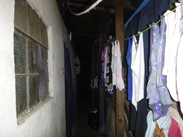 The alley that connects Ricardo’s room to other families' rooms. 