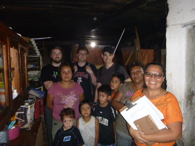 Christian, his family, and volunteers at his home
