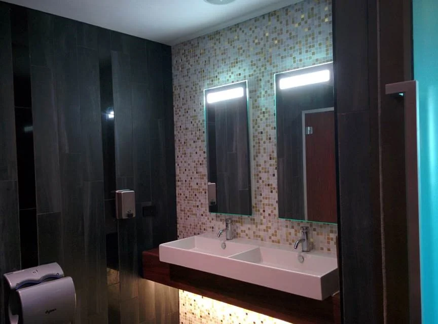 Bathroom Vanity Splash Back - CT13 Special Mix Glass Mosaic 20 x 20mm, Gold/White/Light Metallic. Wall Tiles - CT12A Porcelain 150 x 900mm, Timber Grain & CT12B Polished Porcelain 100 x 600mm, Black.