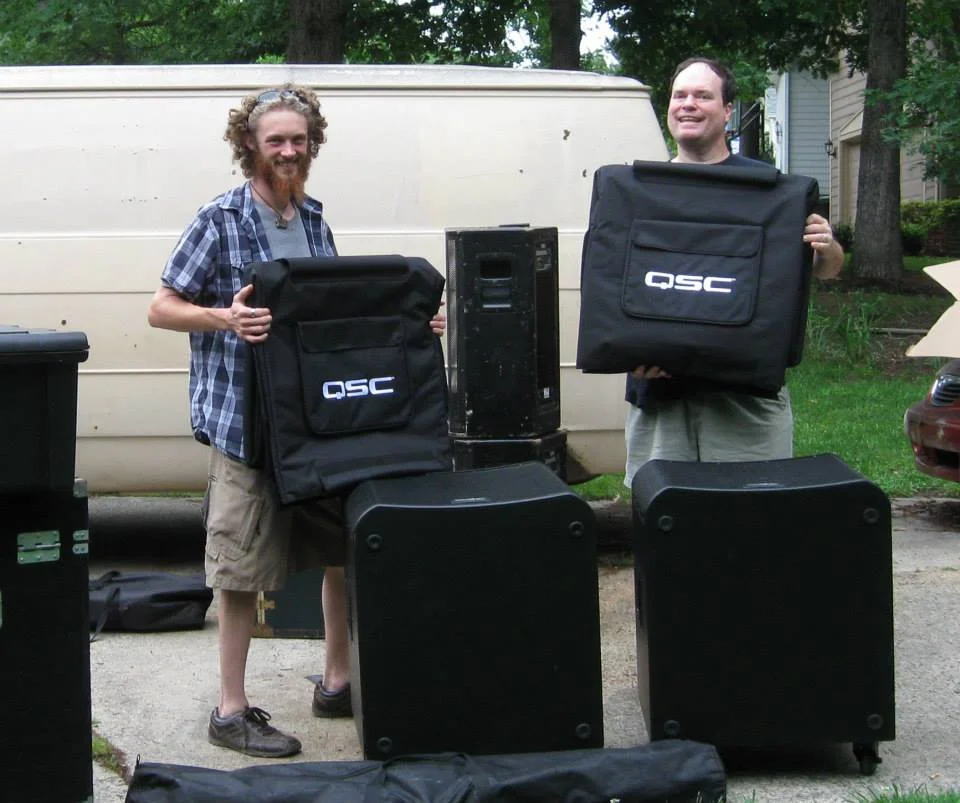 Two sound guys in their natural habitat.