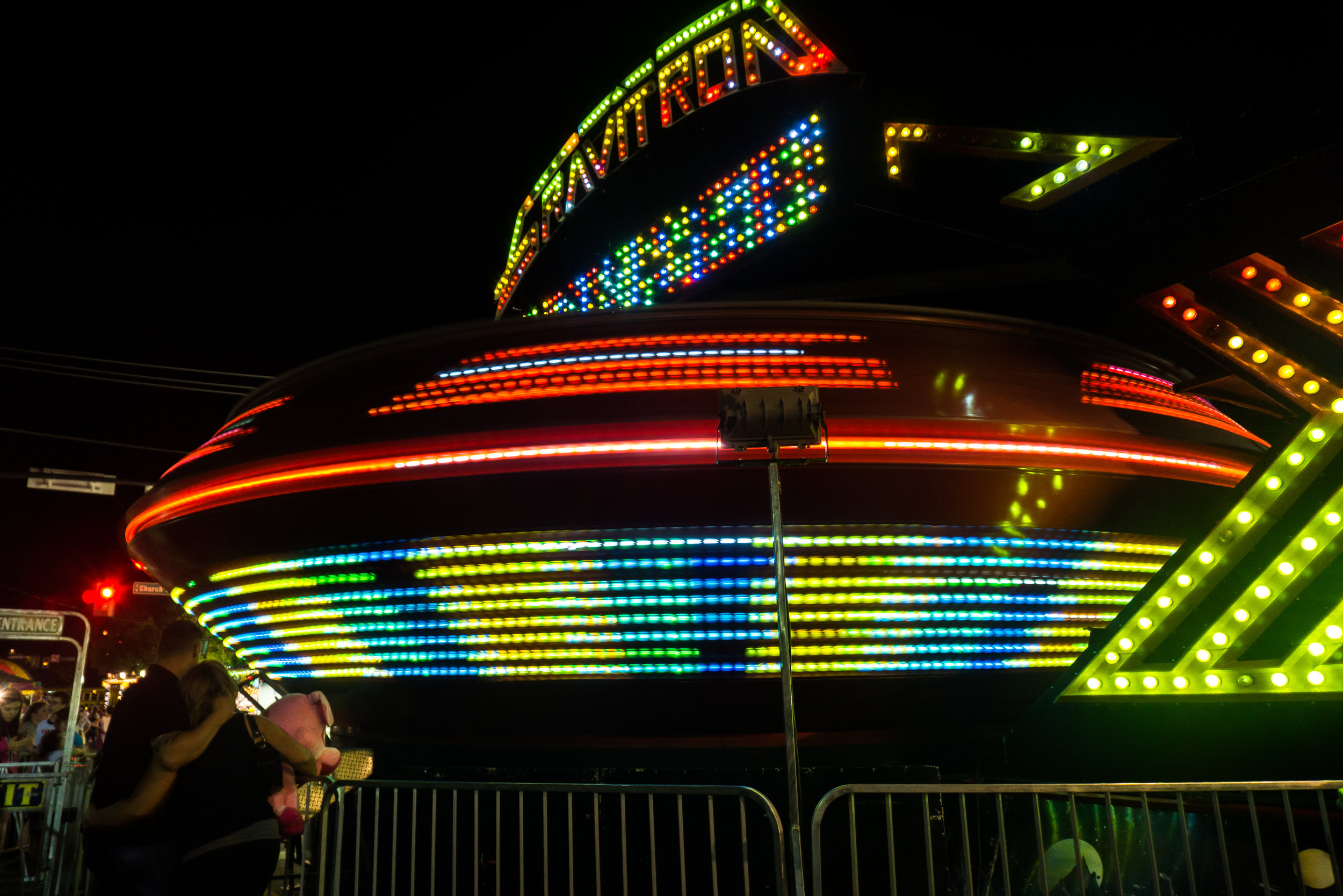 A couple watches the Gravitron spin Friday night at the Ephrata Fair.