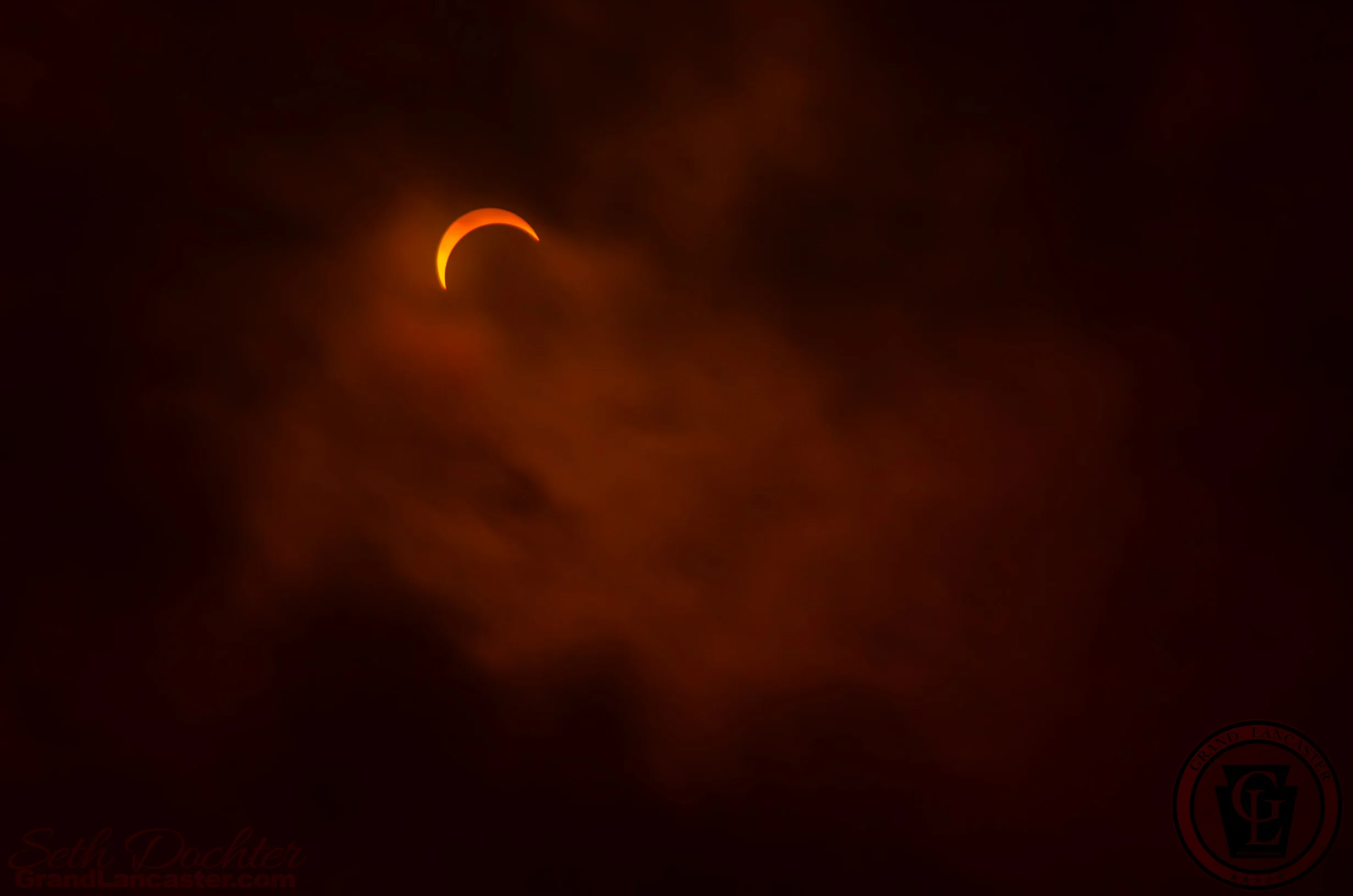 Wisps of clouds passing in front of the eclipse at it's peak in northern West Virginia 8.21.17