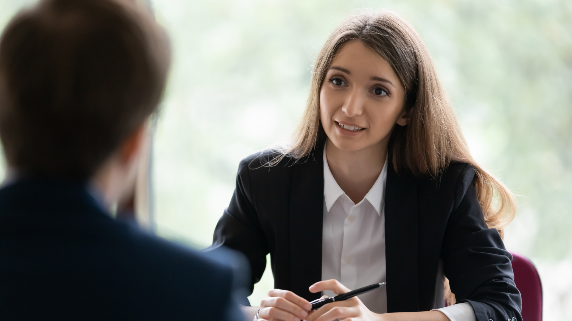 Resume writer reviewing career goals with a client