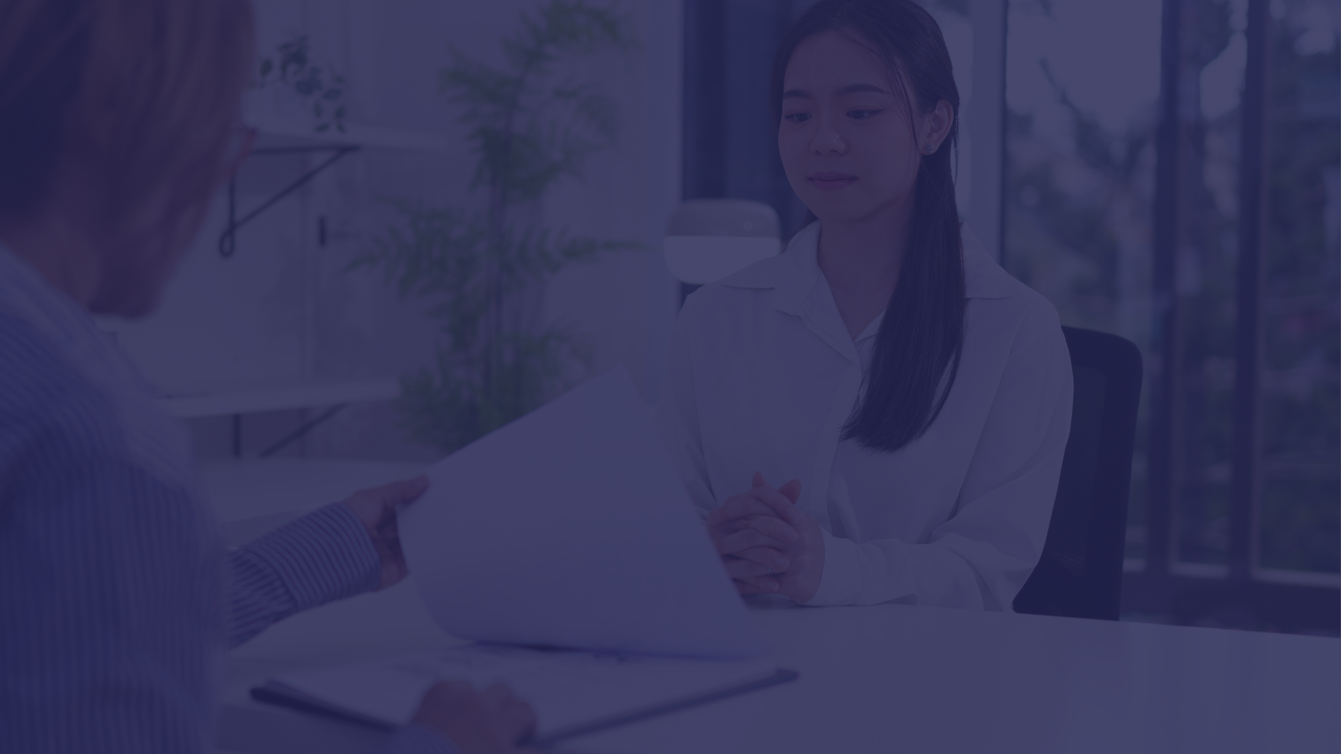Job seeker reviewing professionally written resume pages
