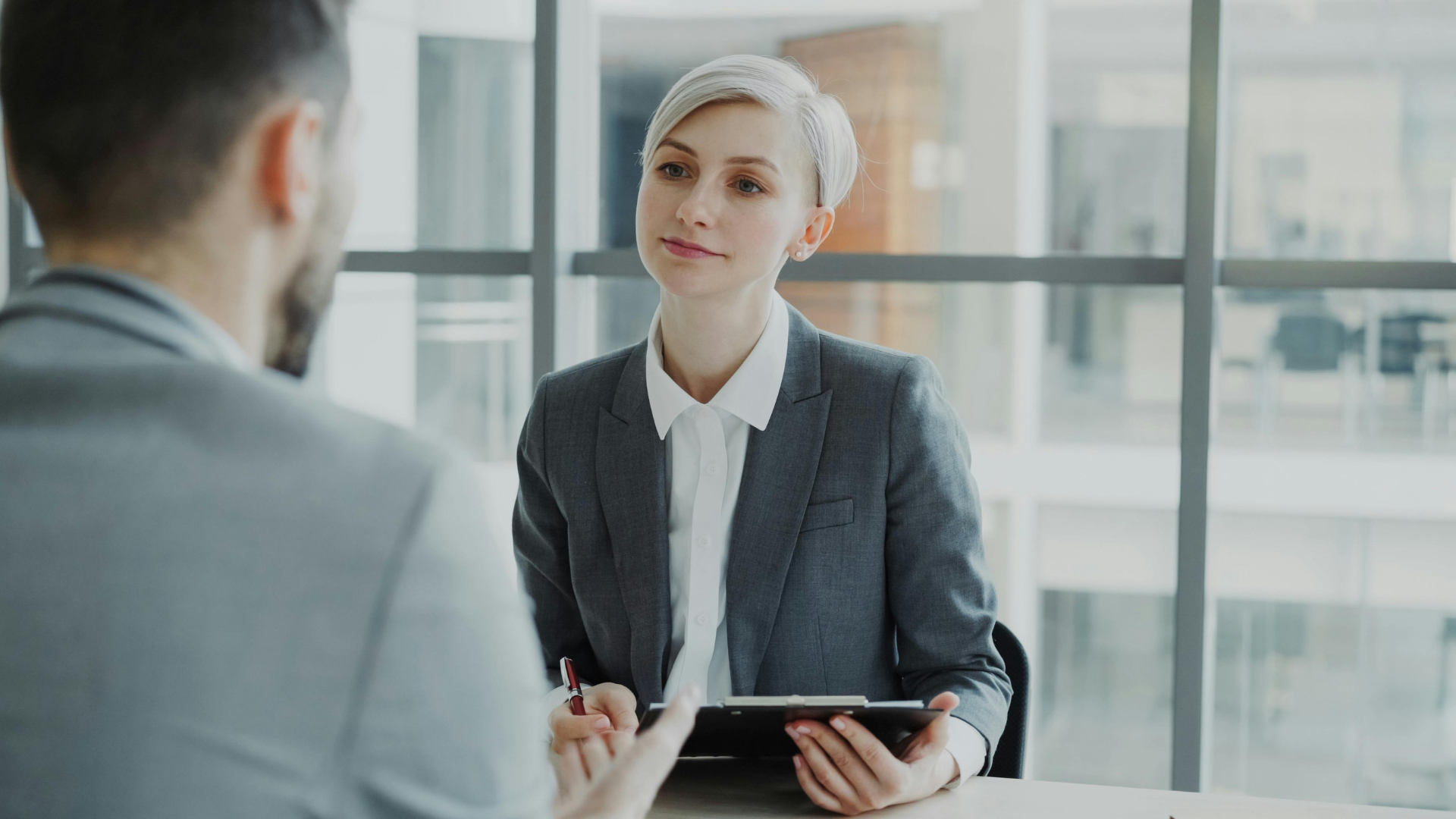 Resume writer speaking with a client