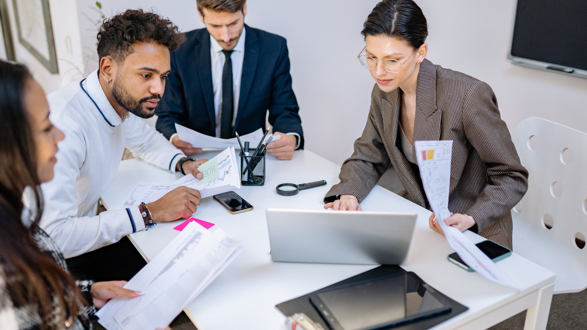 Team of professionals collaborating around a conference table