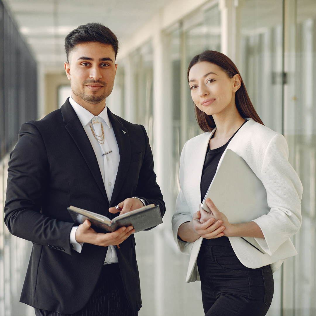 Two professionals collaborating on career documents