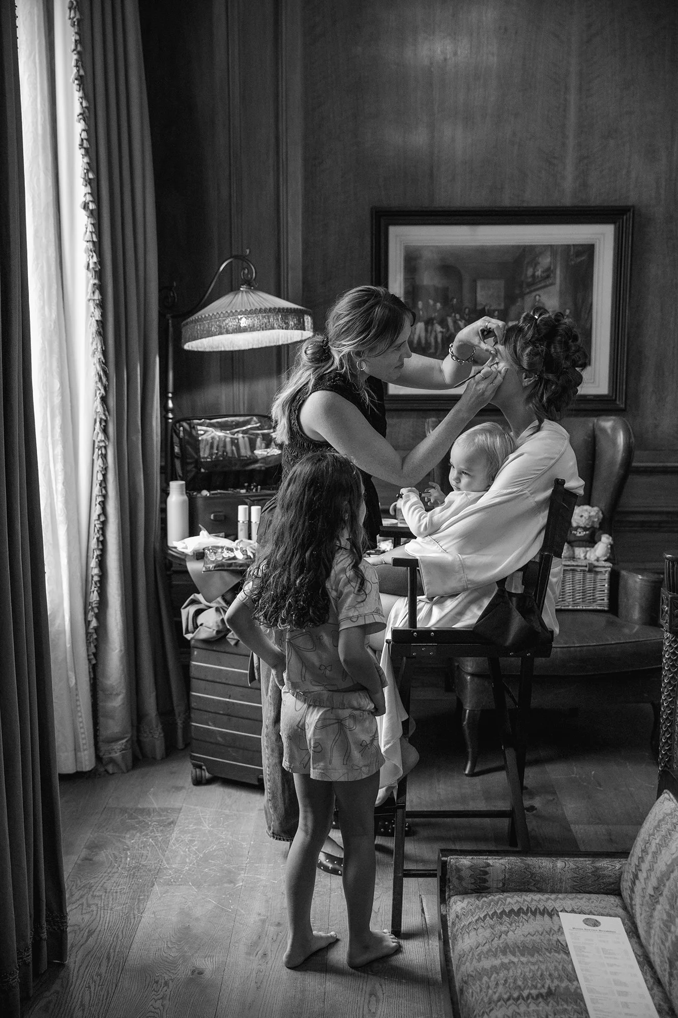 Bridal make-up artist Sophie Higginson preparing a bride on her wedding day at The Ned, London