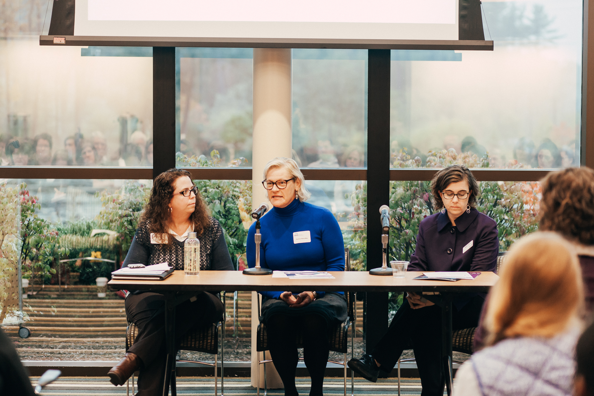 Panelists Annette Sobocinski from Child Care Network, Barbara Niess-May from SafeHouse Center, and Katie Doyle from Ozone House discuss federal budget impacts on their organizations.