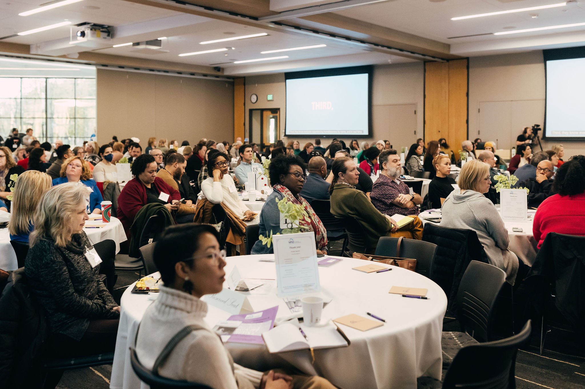 Audience listening to a presentation.