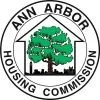 Image is logo with the outline of a house in the center of a circle with a green tree inside it. Around it in a ring it reads, "Ann Arbor Housing Commission."