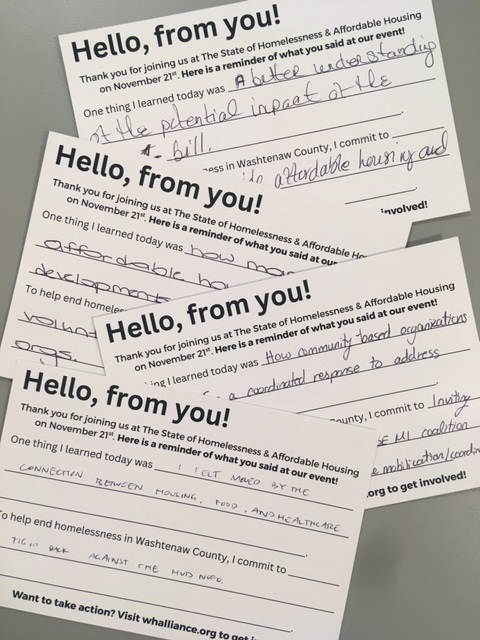 Image is of four postcards asking participants to write down one thing they learned from attending the annual event and what they will commit to in helping to end homelessness.