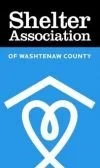 Image is a logo. At top in black rectangle in white letters it reads, "Shelter Association." Below in blue rectangle in white letters, it reads, "of Washtenaw County" with an image of a roof top covering a pretzel-shaped heart.