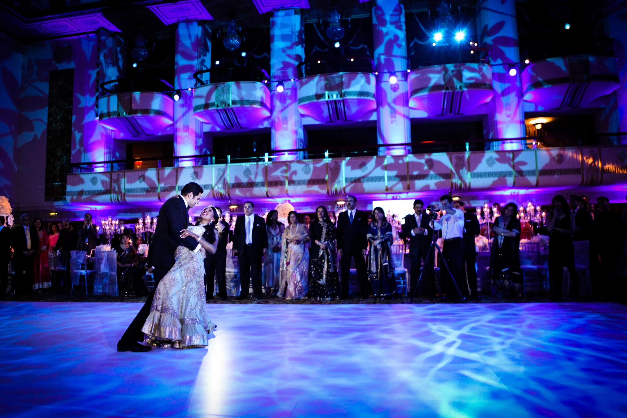 Couple dipped on lit dancefloor