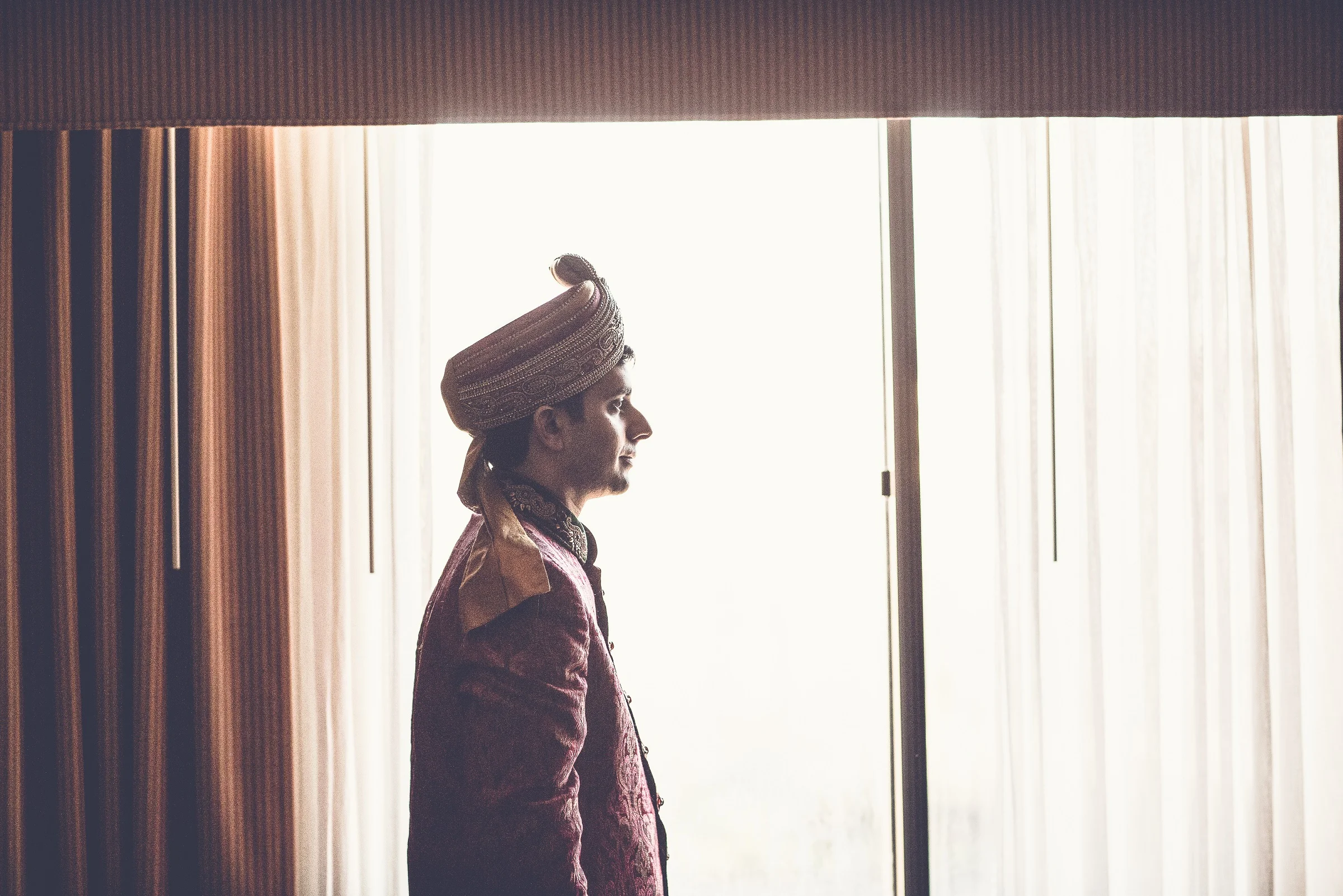 GROOM READY AT WINDOW