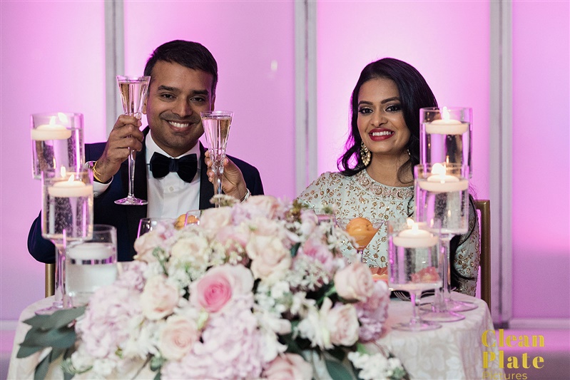 INDIAN WEDDING BRIDE AND GROOM AT DINNER TABLE.jpg