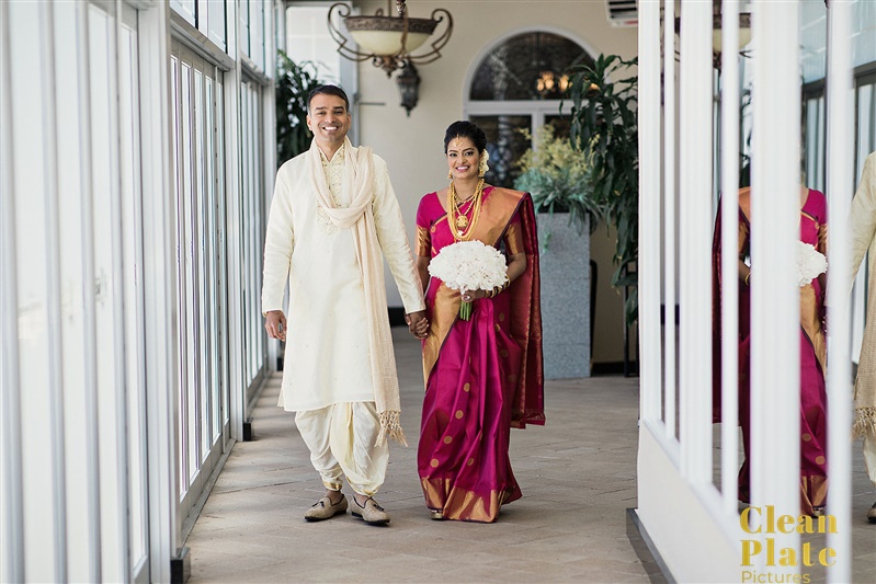 INDIAN WEDDING BRIDE WITH FLOWERS AND GROOM WALKING.jpg