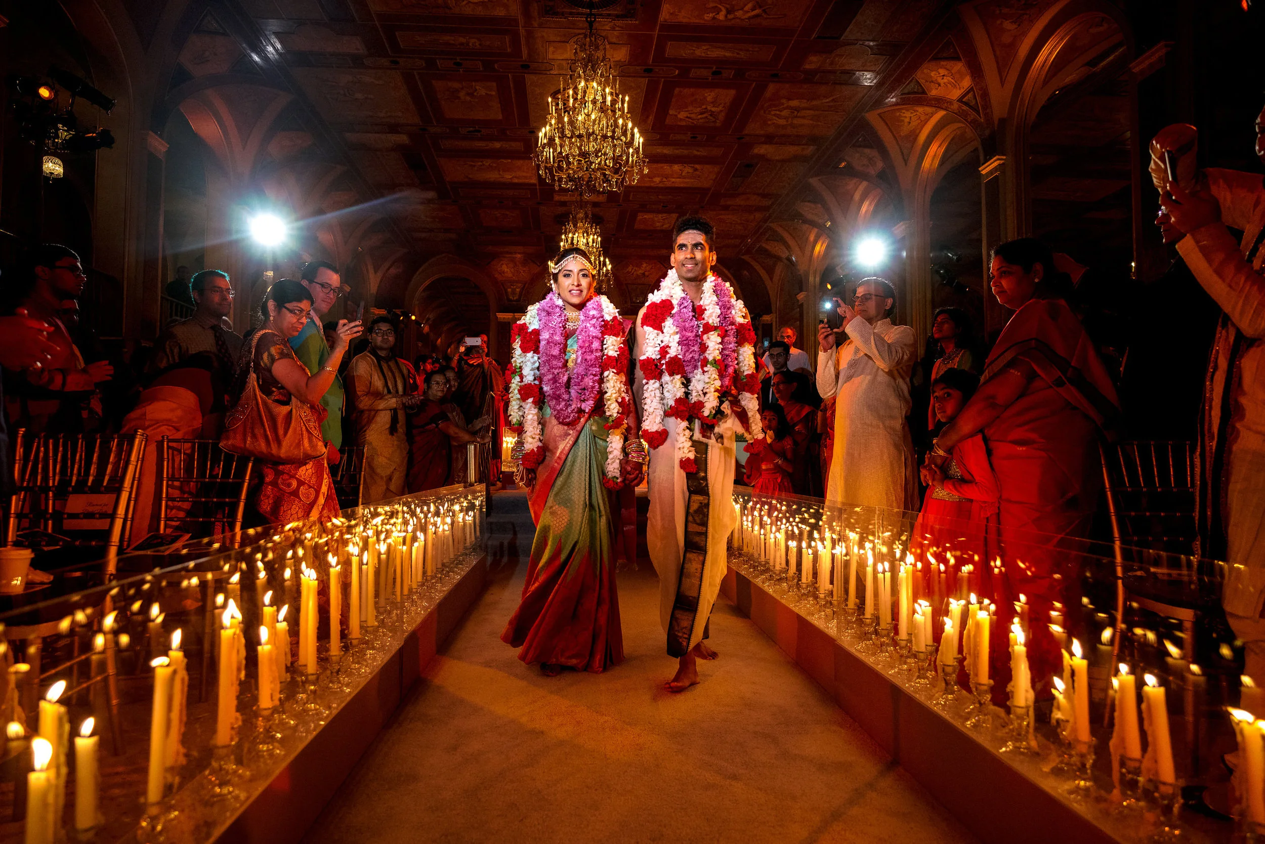 INDIAN WEDDING BRIDE AND GROOM WALKING DOWN CEREMONY AISLE.JPG
