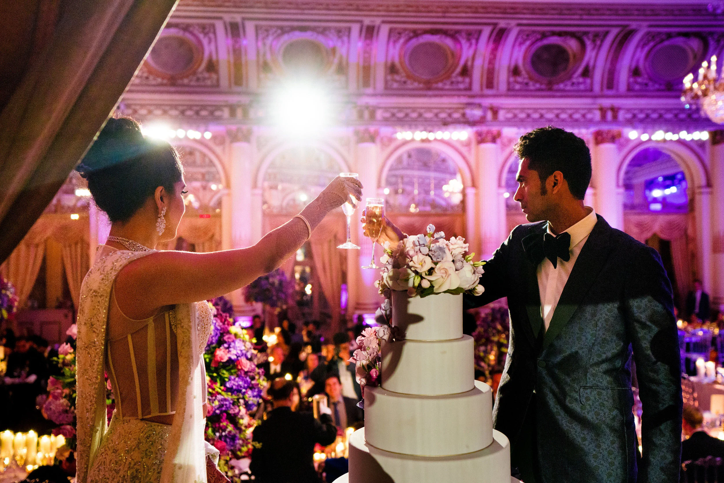 INDIAN WEDDING BRIDE AND GROOM CUTTING CAKE.JPG