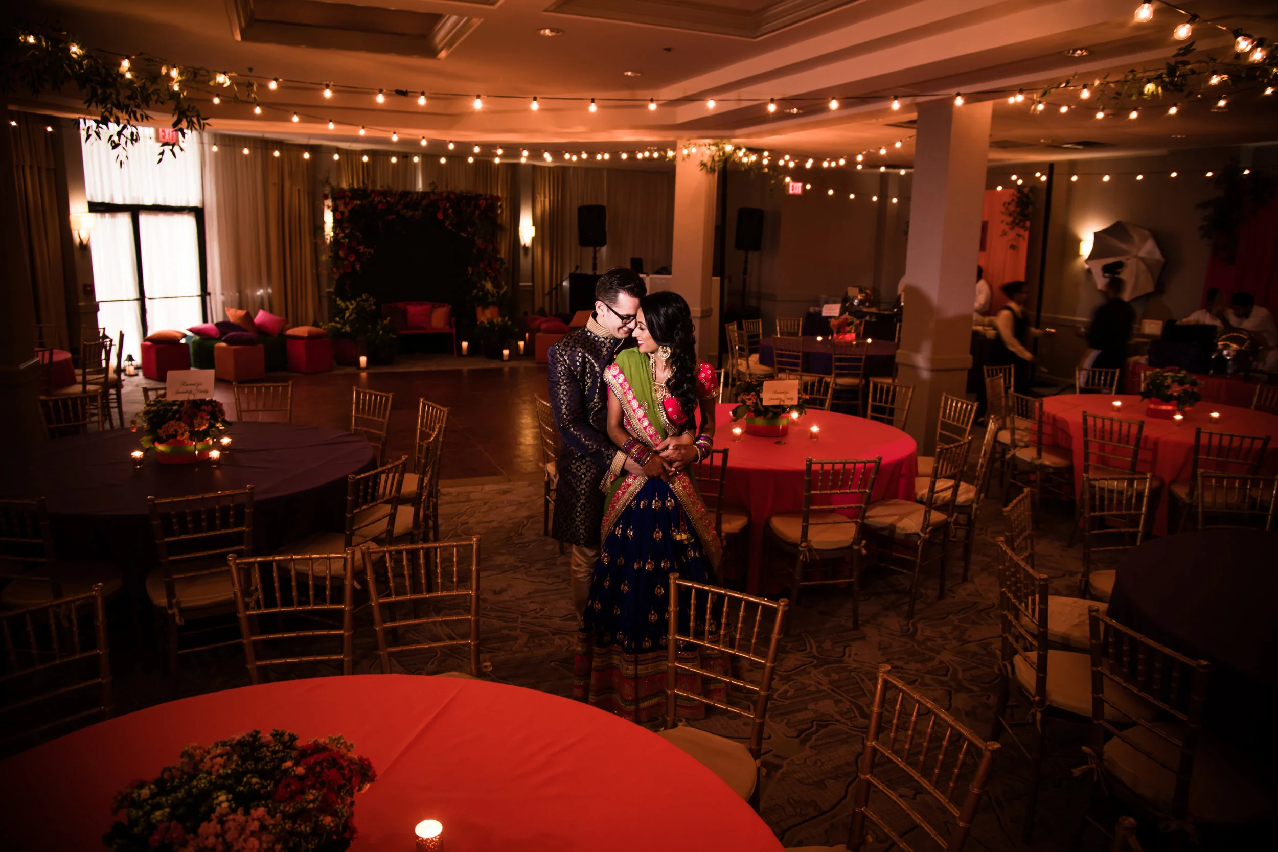 INDIAN WEDDING SANGEET BRIDE AND GROOM WITH VENUE DECOR.jpg