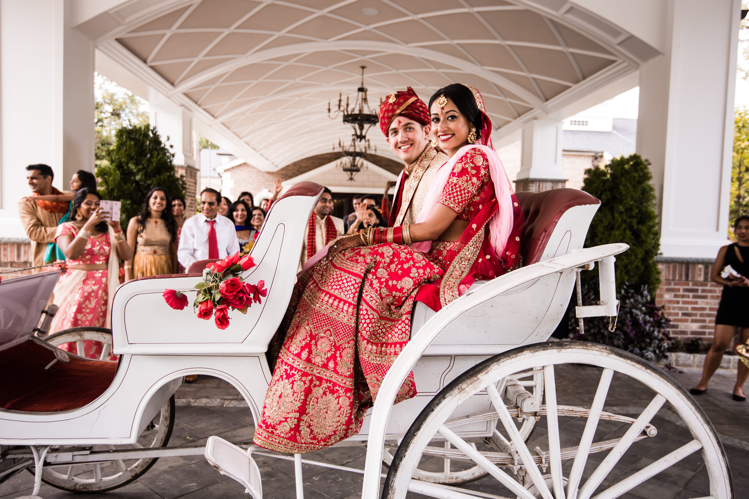 INDIAN WEDDING BRIDE AND GROOM ON CARRIAGE.jpg