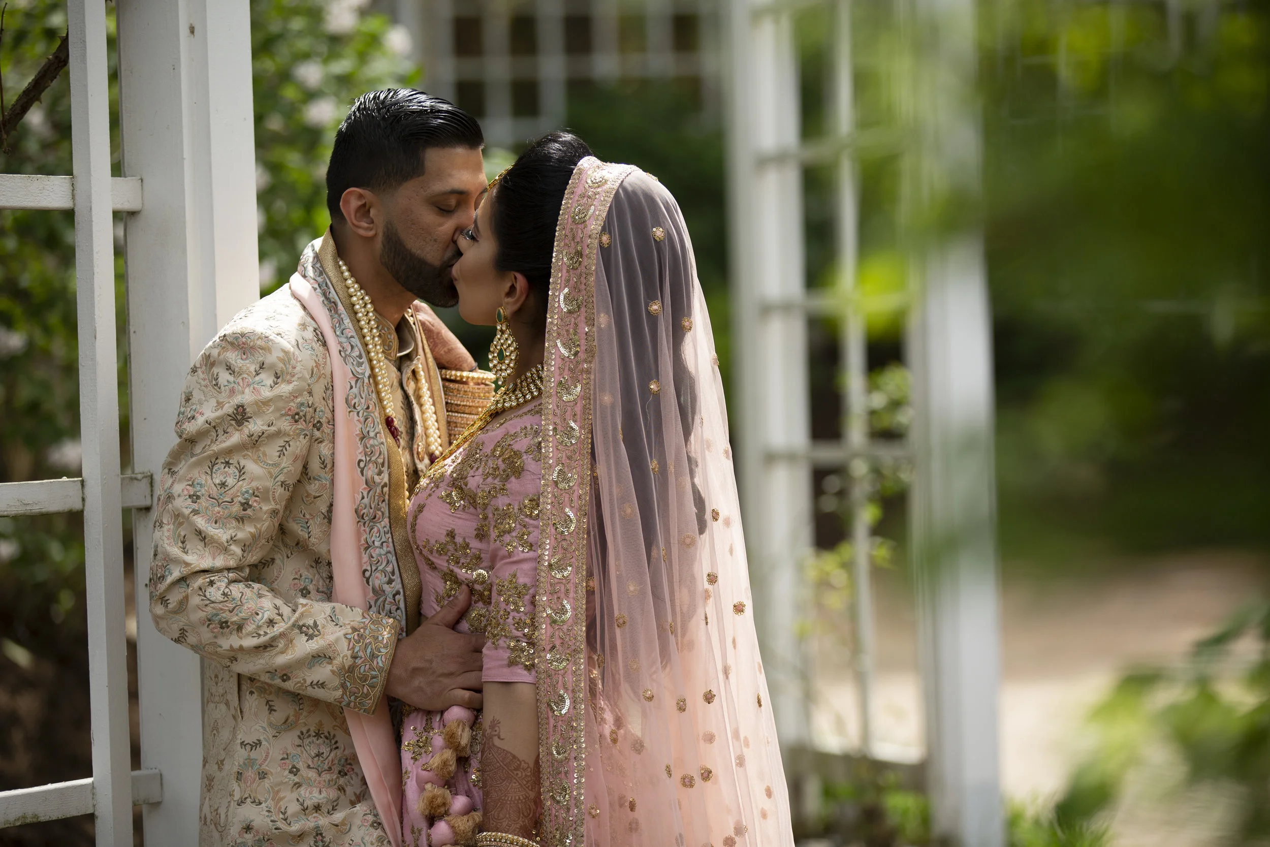 INDIAN WEDDING CEREMONY BRIDE AND GROOM KISS.JPG