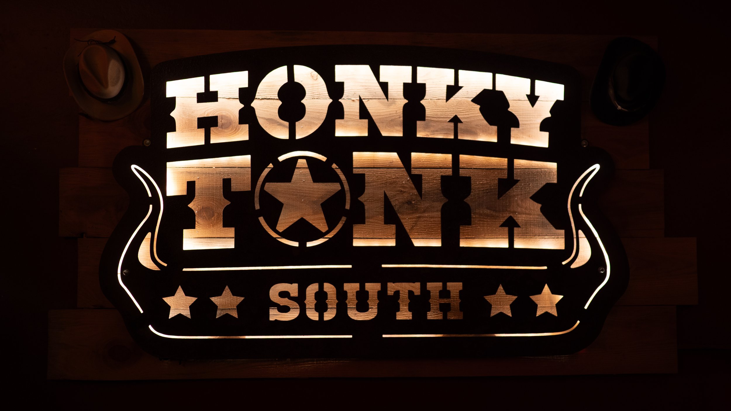 Illuminated Honky Tonk South sign inside the Nashville inspired live music venue on Congress Street in Savannah.