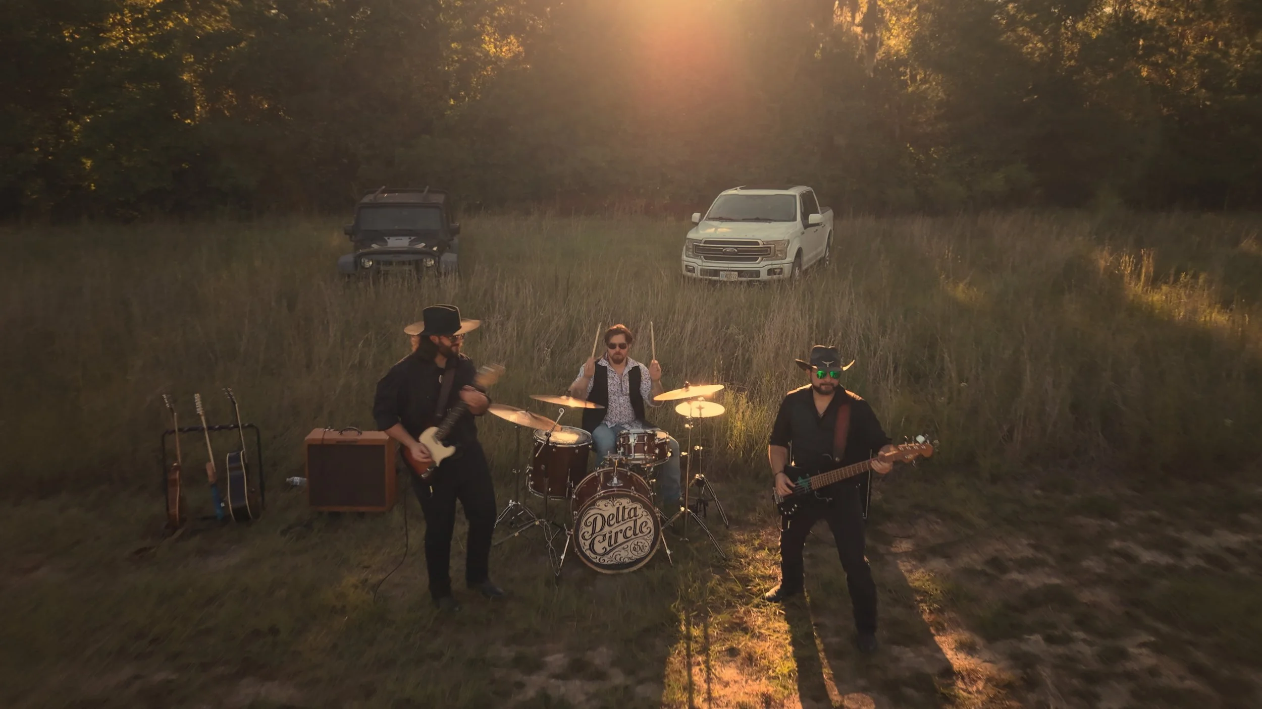 Delta Circle performing My Own Doctor in a field outside Savannah during golden hour.