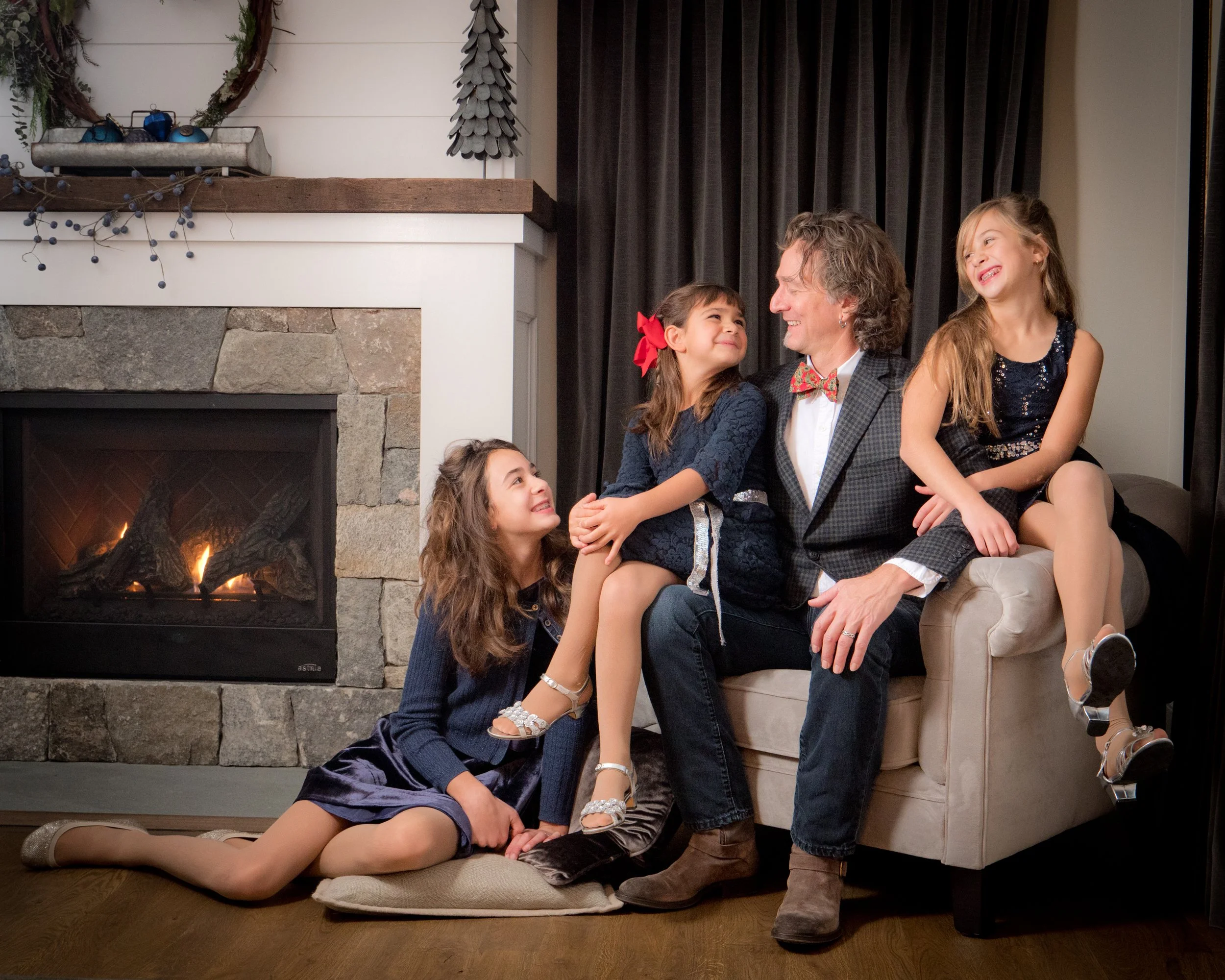 A family portrait that became something more natural when laughter replaced the pose and everyone forgot about the camera.