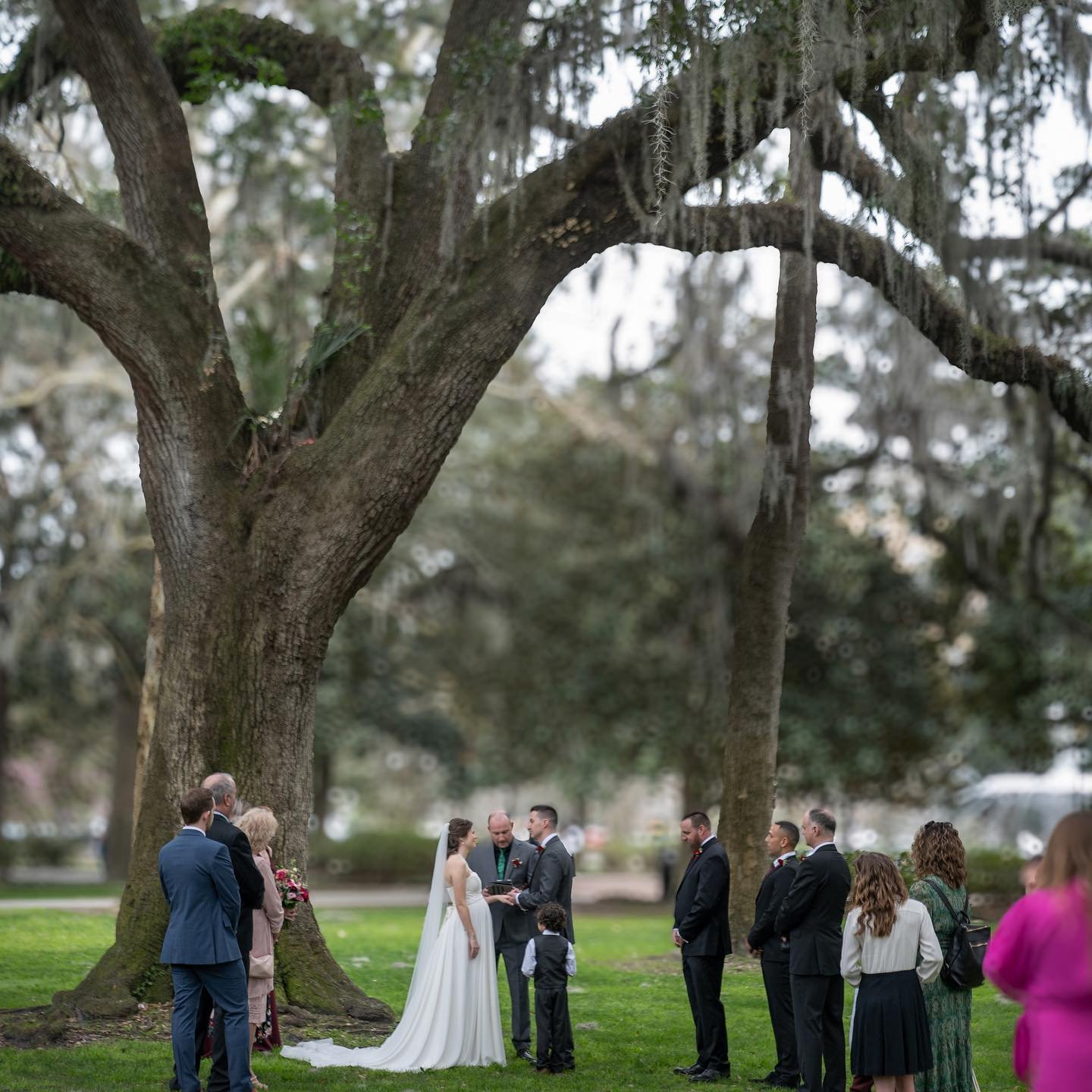 Commitment beneath the #liveoaks of #forsythpark #savannahga Reach out to learn more about our #wedding photography