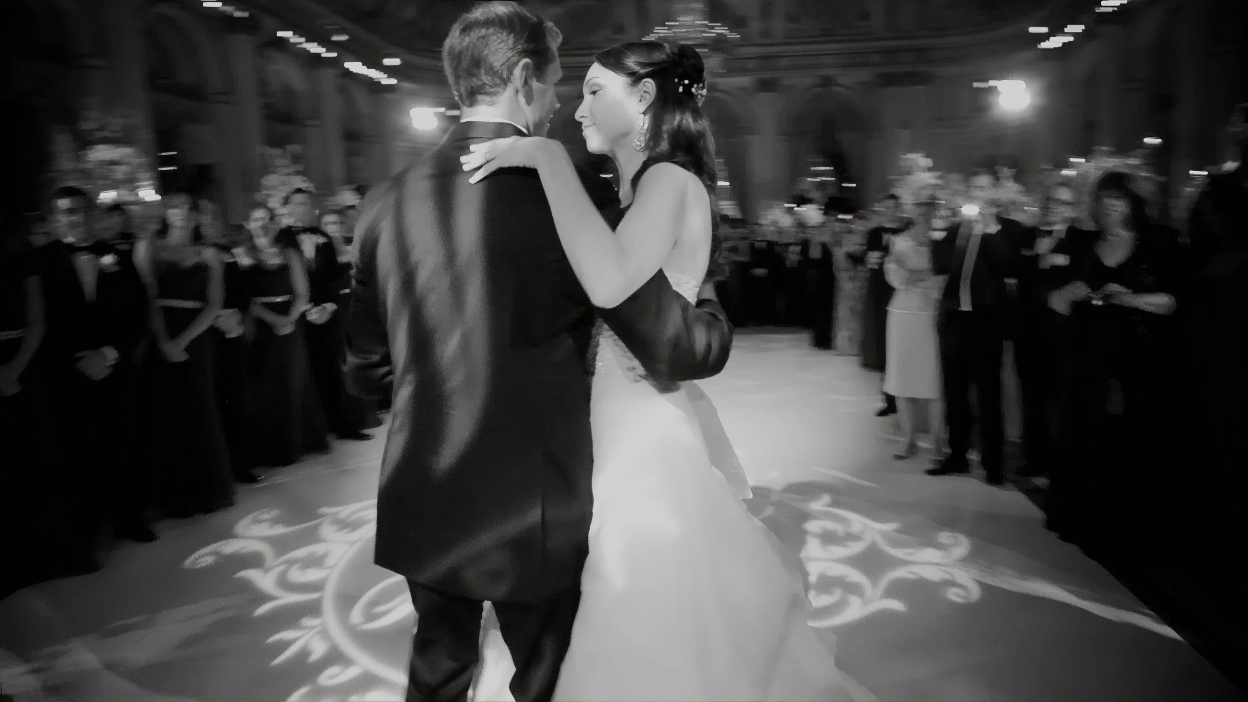 Bride's gown moves through the frame during a first dance at The Plaza Hotel in New York.