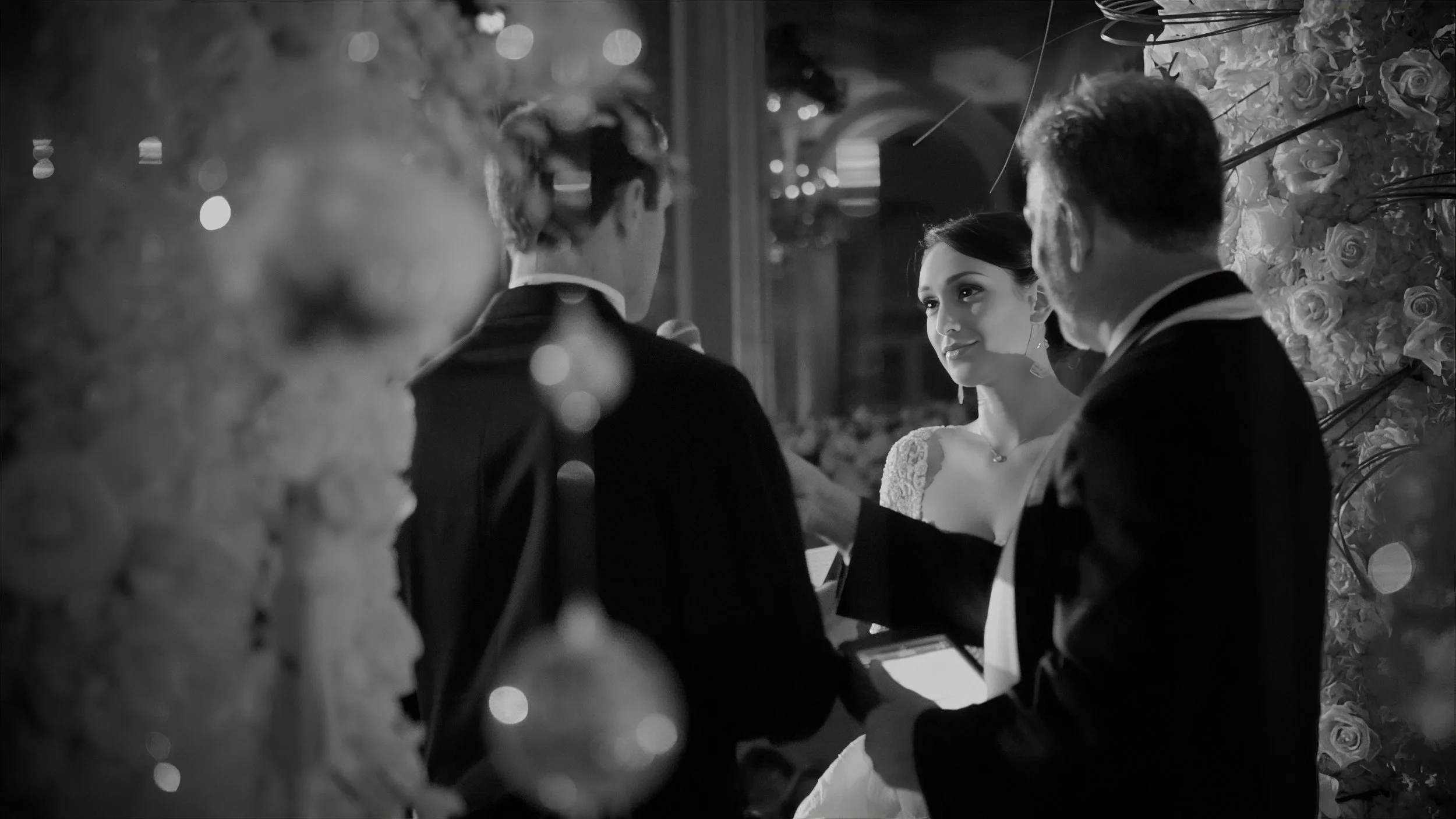 Bride looking toward the groom during an intimate ceremony moment at The Plaza Hotel in New York.