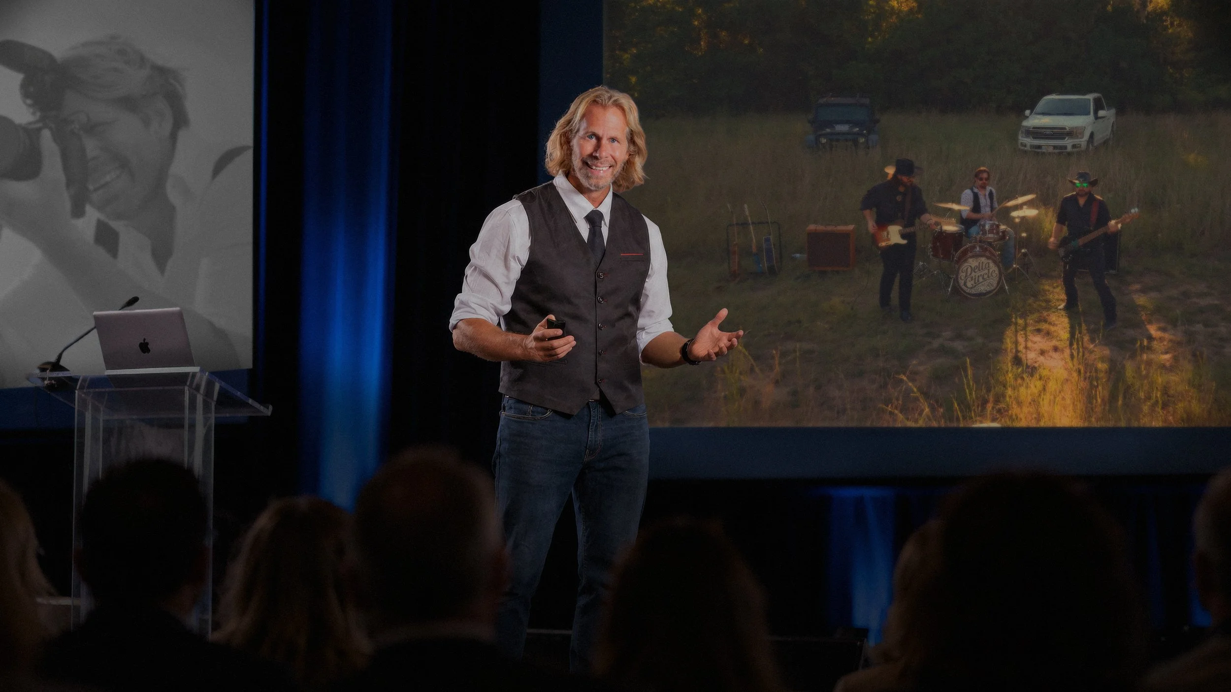 Keynote speaker Charles Maring presenting on stage, sharing insights on creativity, curiosity, collaboration, and the power of connecting ideas through The Creative Flywheel.