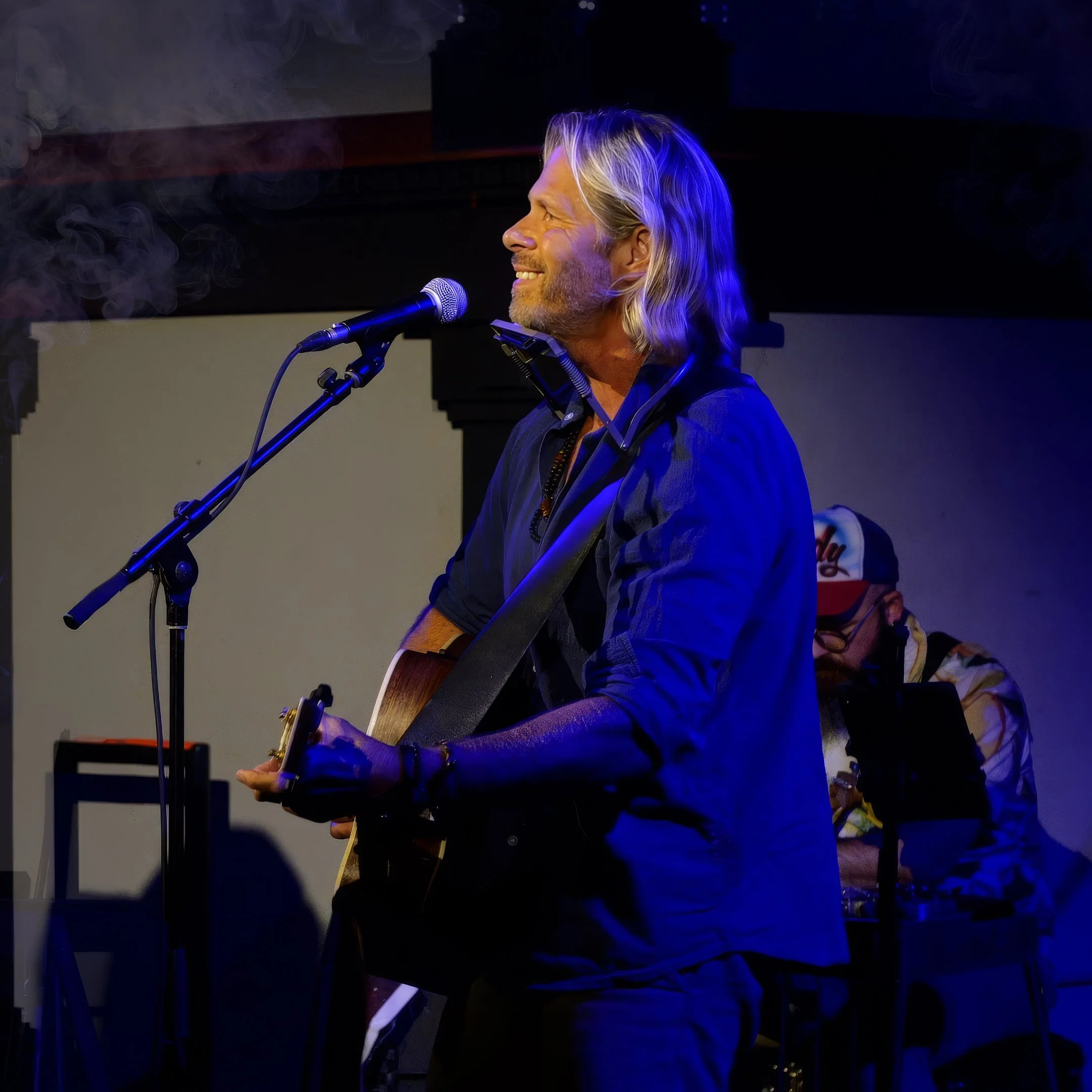 Charles Maring performing as a musician, bringing music, storytelling, and creative expression into his approach to keynote speaking.