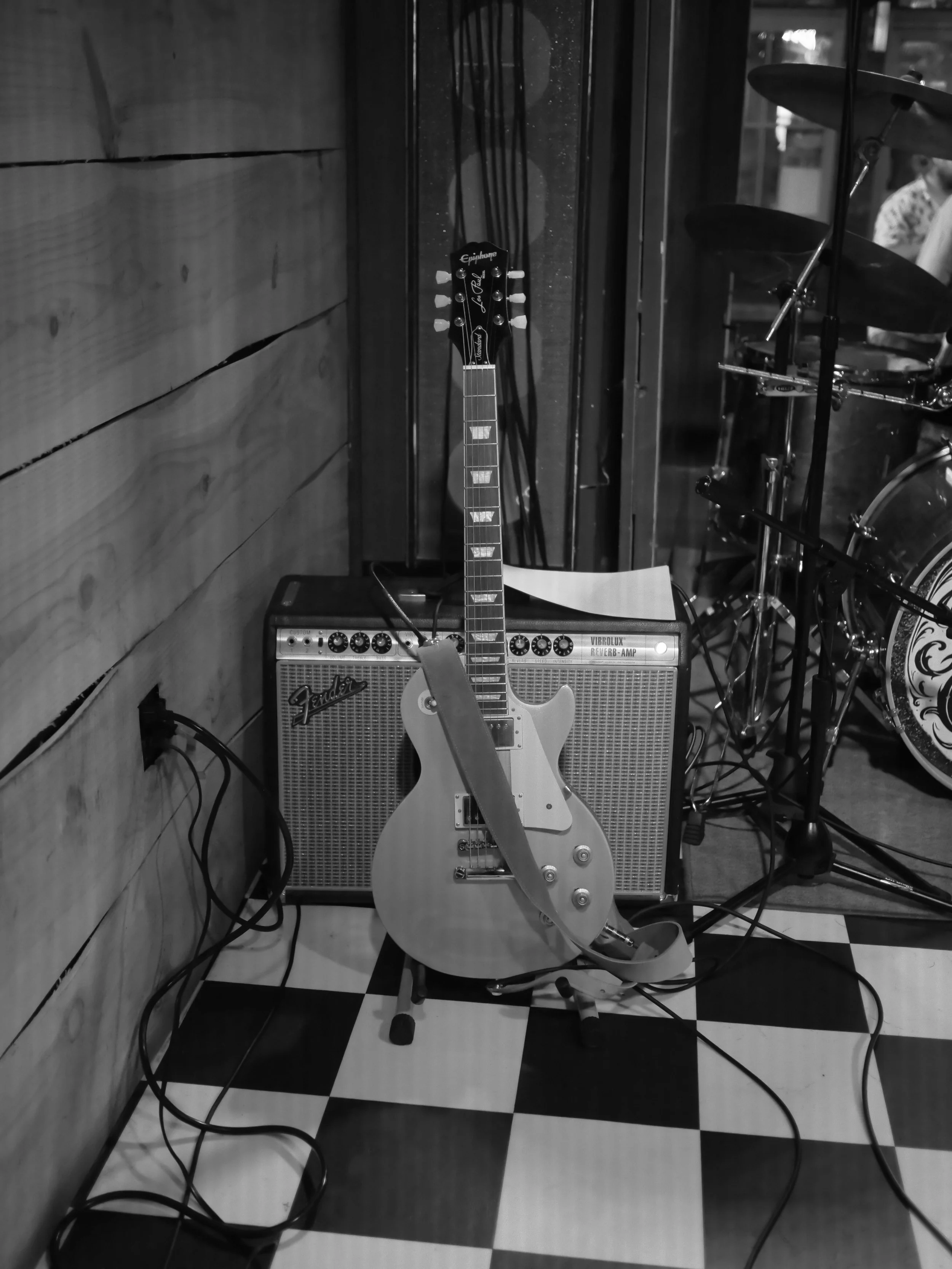 Electric guitar resting beside an amplifier on the Honky Tonk South stage in Savannah.