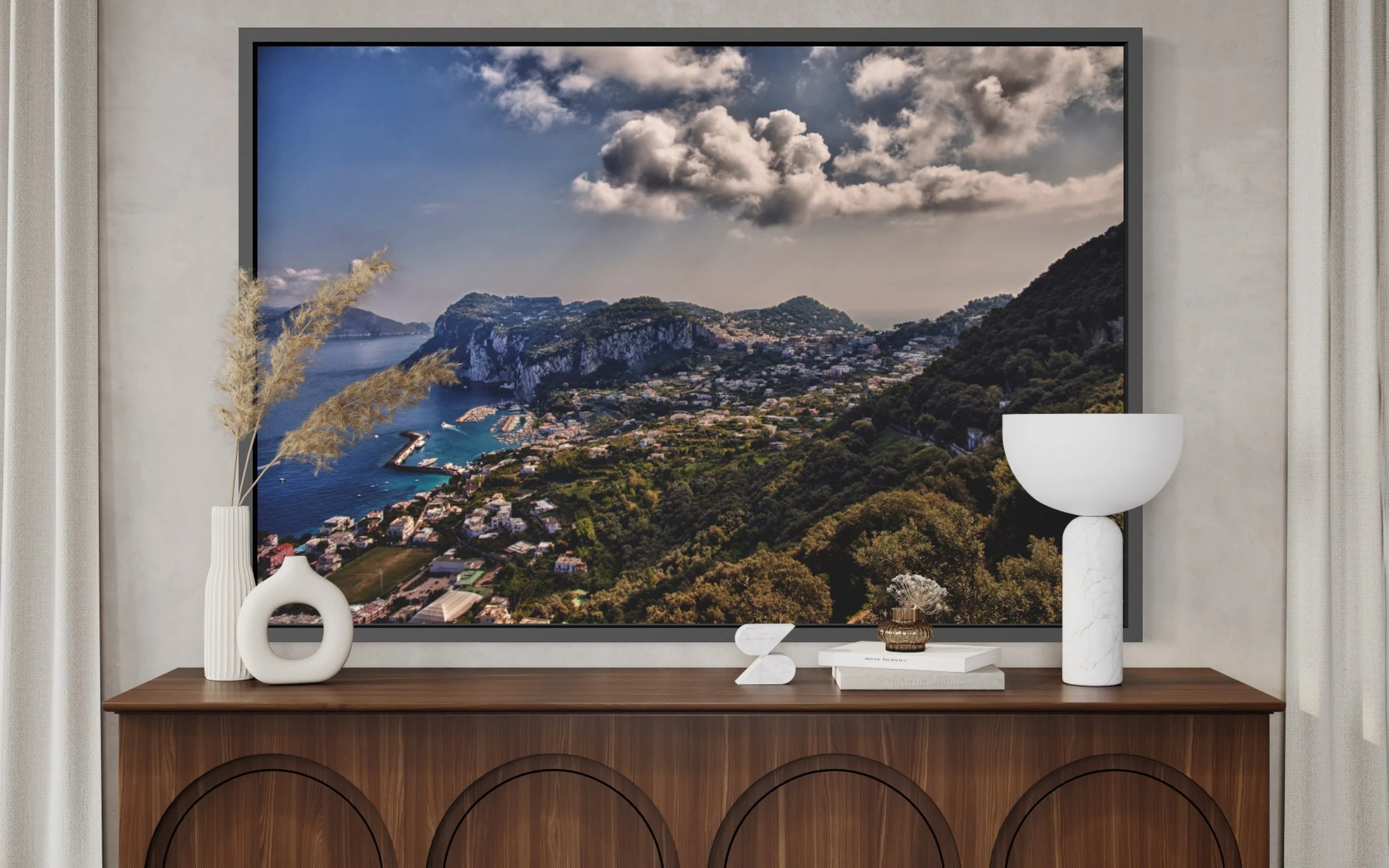 Above Marina Grande, Capri, Italy. The Mediterranean, mountains, and inhabited coastline unfold beneath sculptural clouds.