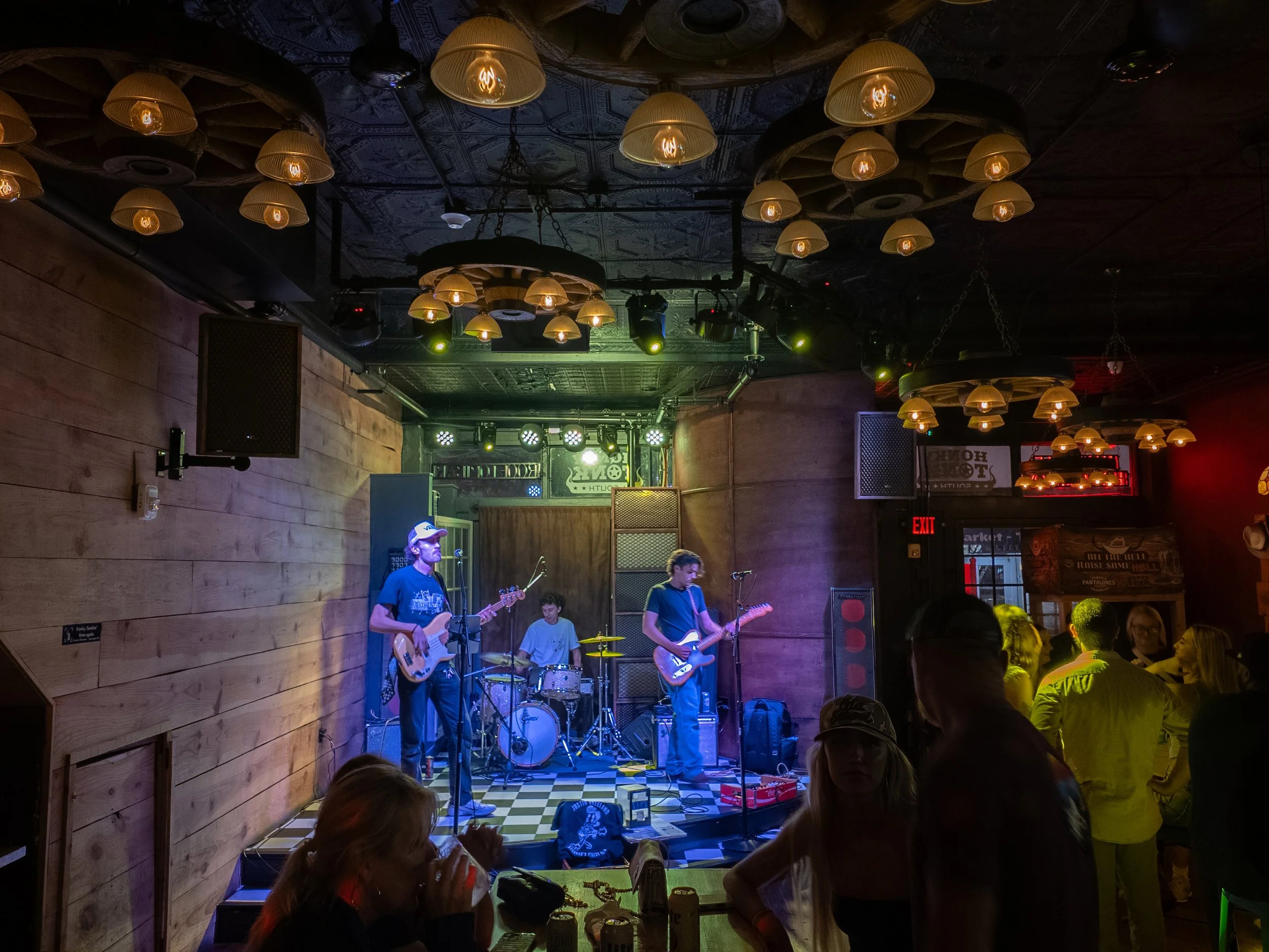 Justin Vreeland and Friends perform live beneath warm hanging lights at Honky Tonk South in downtown Savannah.