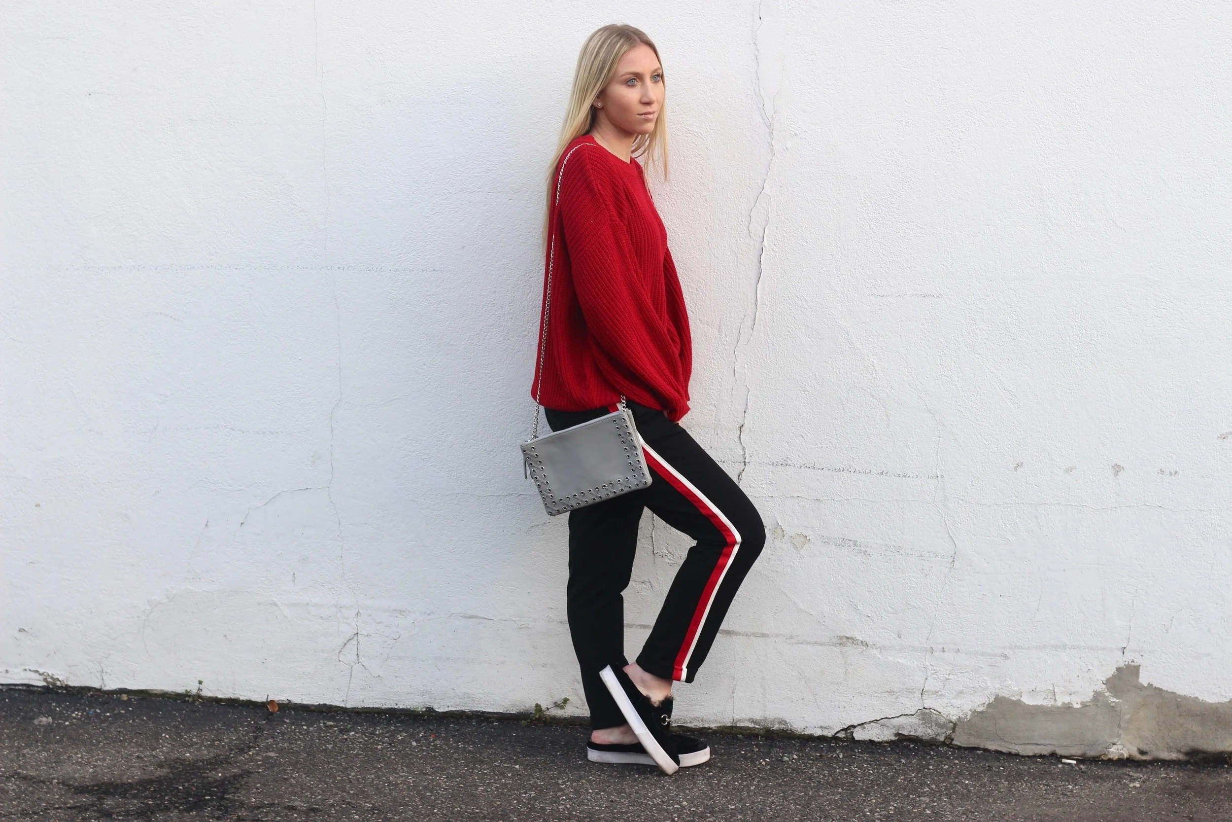Carly of Au Courant Life wearing red and white striped trousers from Zara and red sweater
