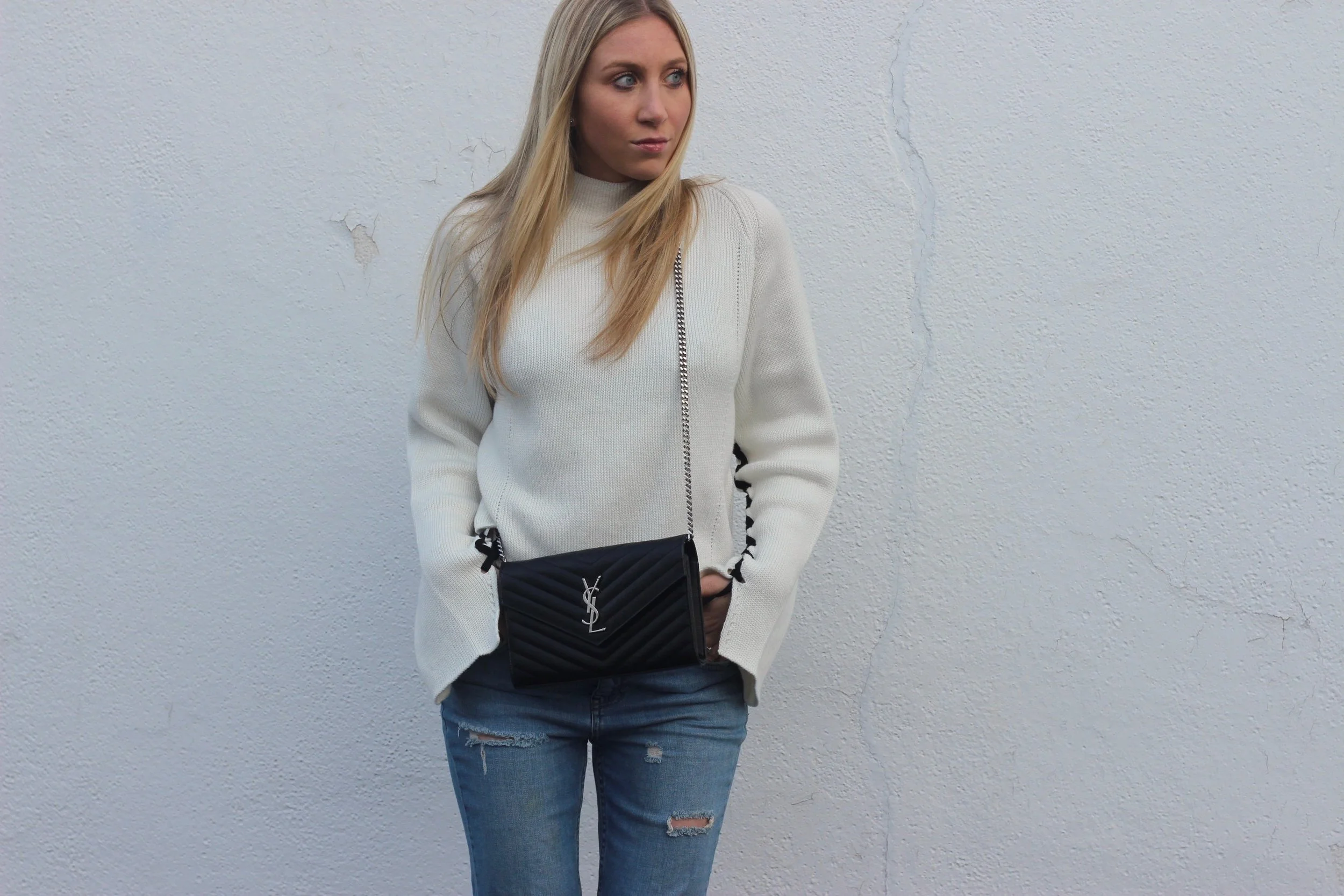 Boyfriend jeans, ysl bag, and statement sleeve sweater by Au Courant Life