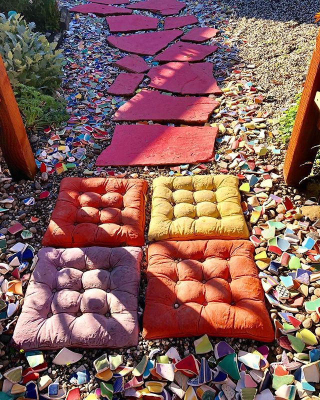 I&rsquo;m redoing my front walkway under the new arbor. It&rsquo;s a work in progress. The pillows are concrete! #landscape #design #justforfun #tuffets #polished #pottery #shards. #arbor #path #walkway #welcome